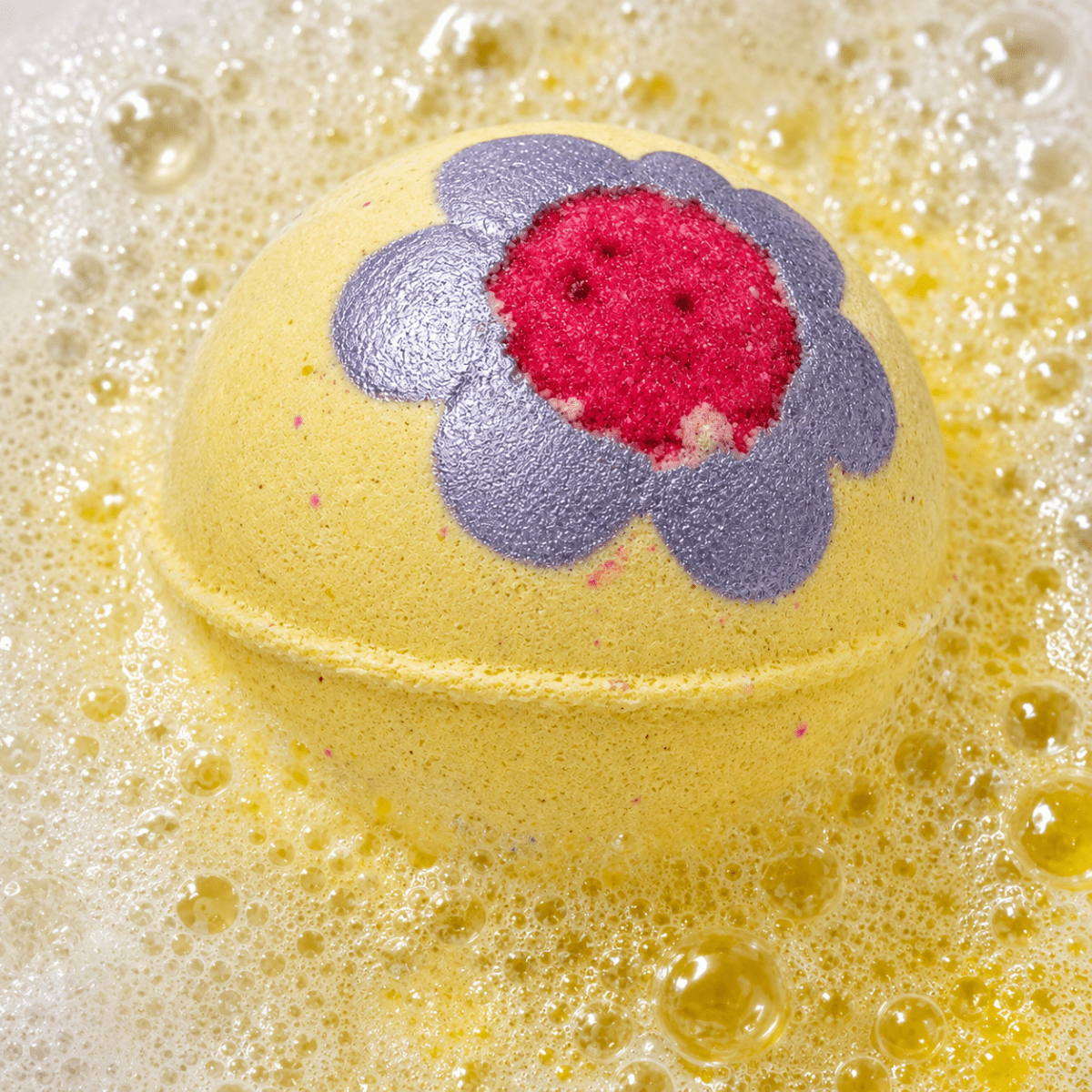 Night Bloom White Tea Bath Bomb fizzing in water by Bath Box