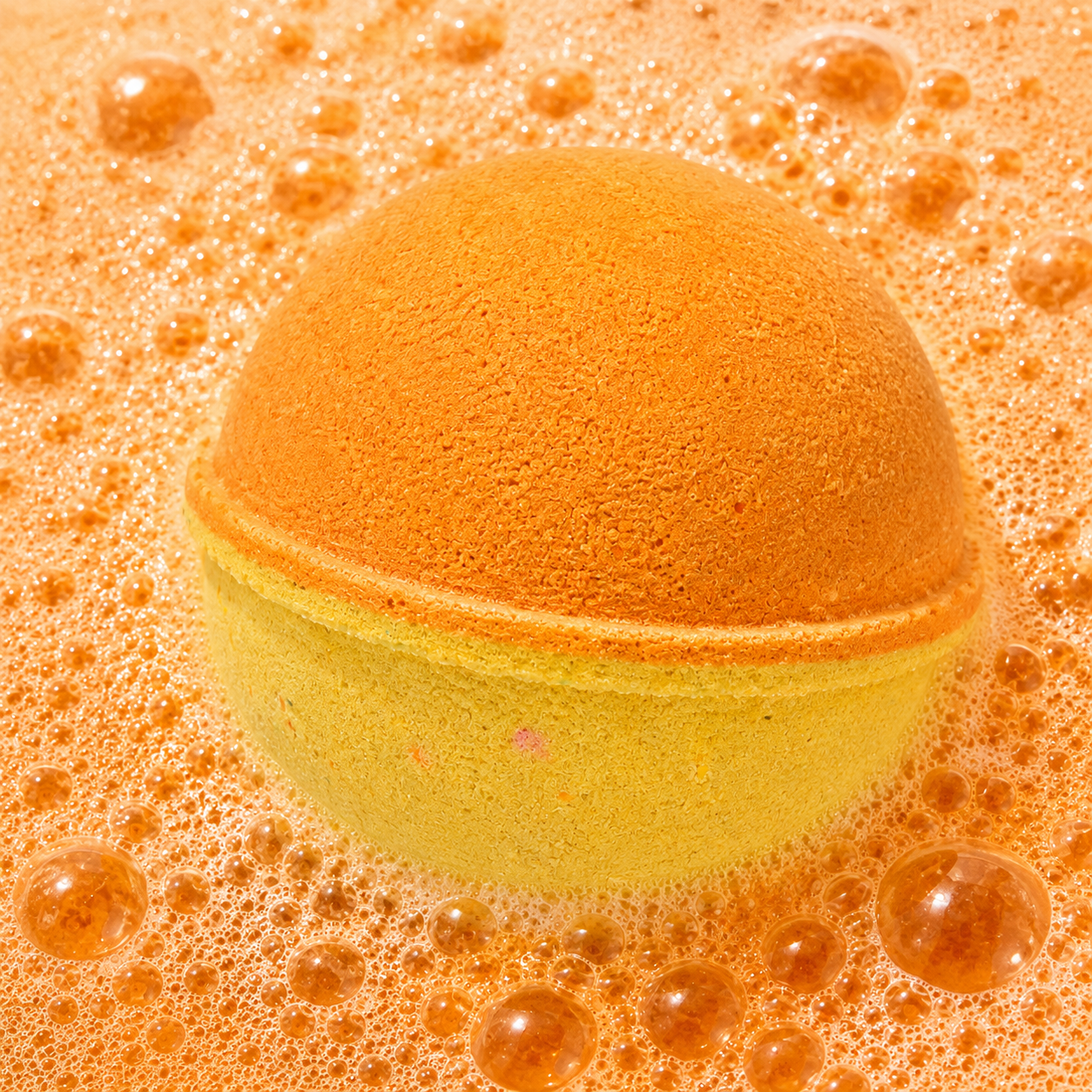 Quiet Escape Cucumber Melon Bath Bomb fizzing in water by Bath Box