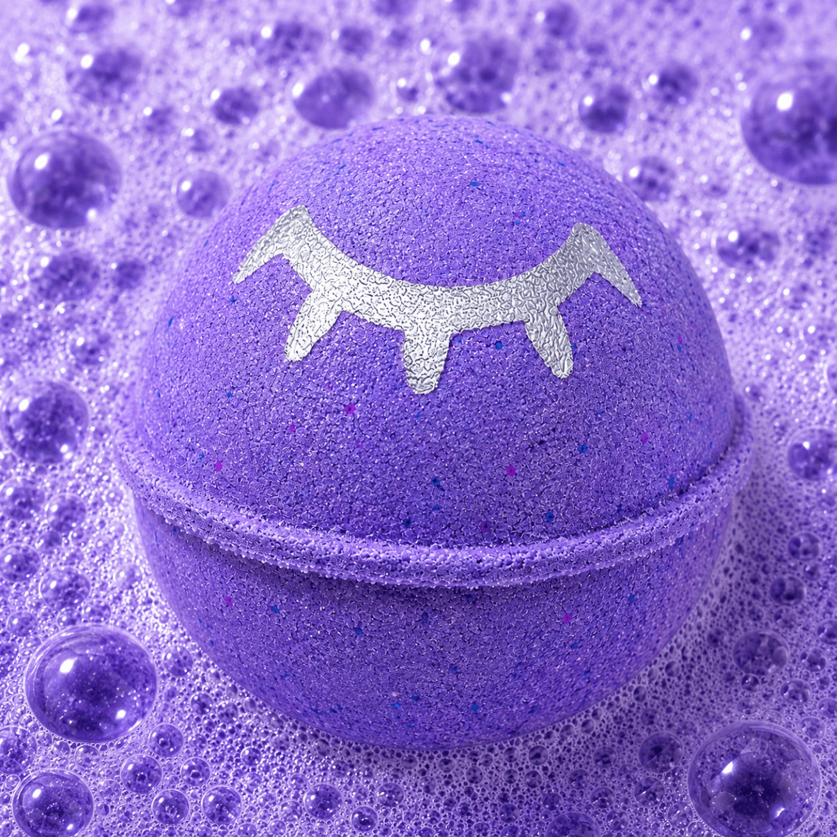 Sweet Dreams Cashmere Silk Bath Bomb fizzing in water by Bath Box