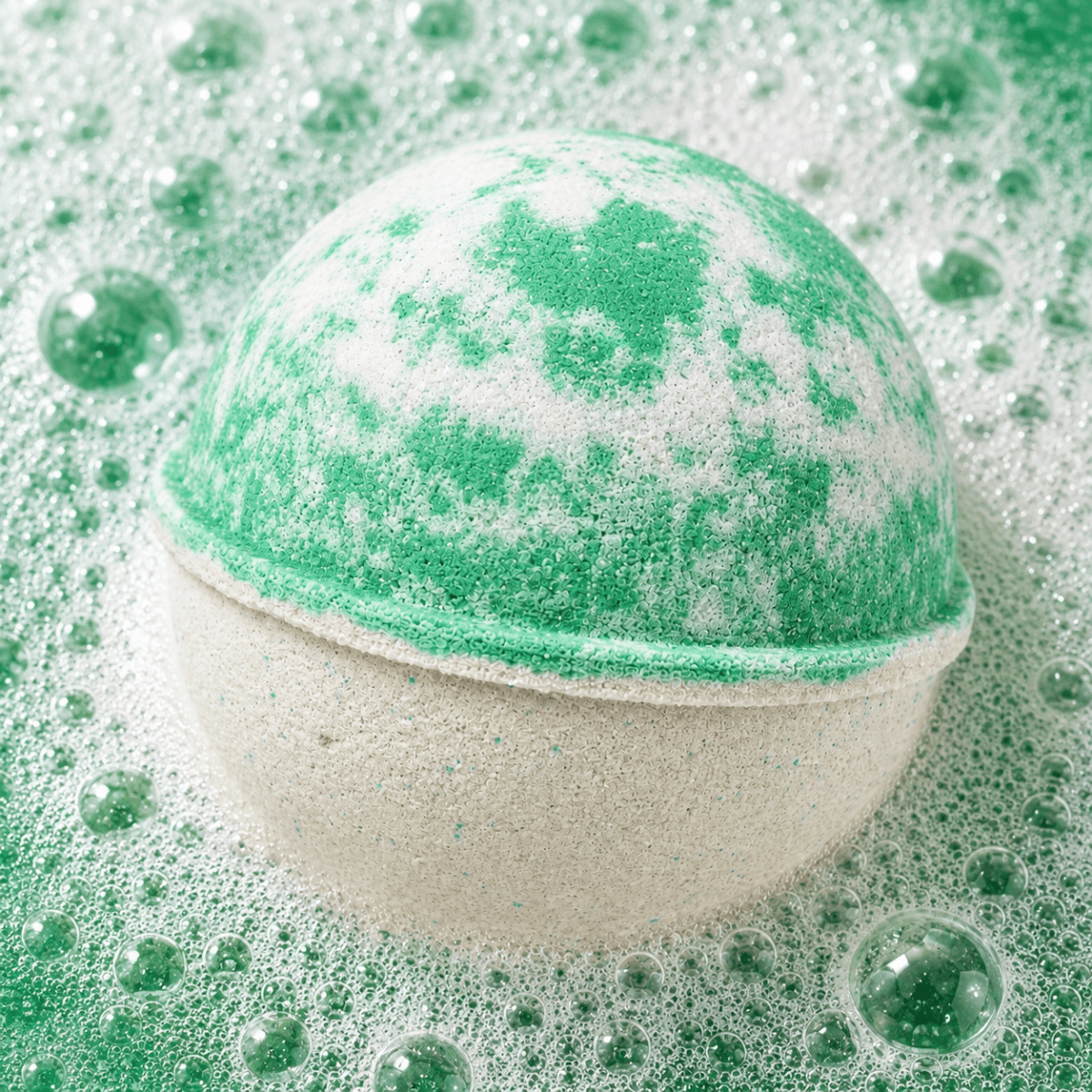 Zen Garden Vanilla Bourbon Bath Bomb fizzing in water by Bath Box