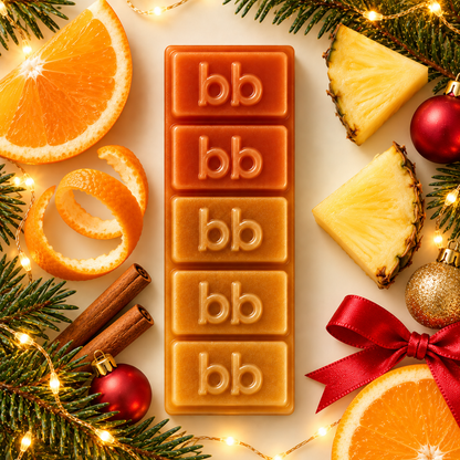 Christmas Glow Melts burnt orange to amber soy wax bar with orange slices, pineapple, cinnamon, baubles and festive lights