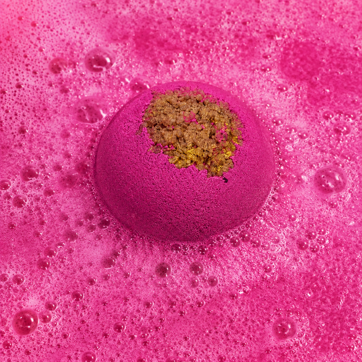 After Hours Moroccan Spice Bath Bomb fizzing in water by Bath Box