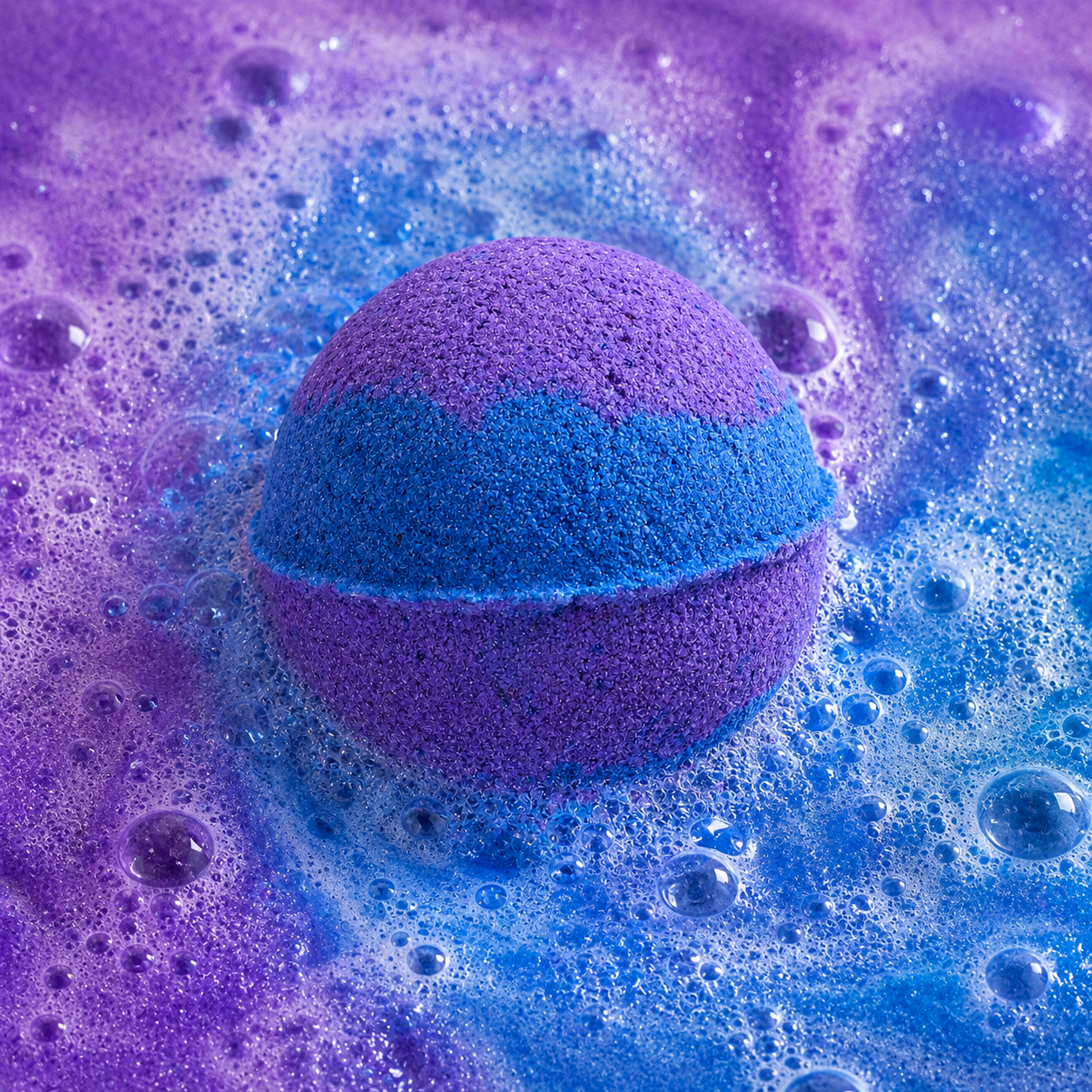 Deep Sleep Honey Lavender Bath Bomb fizzing in water by Bath Box