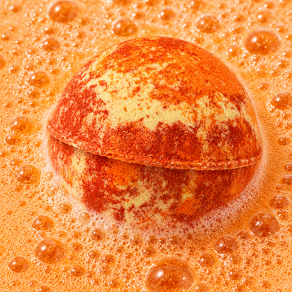 Recharge Musk & Myrrh Bath Bomb fizzing in water by Bath Box