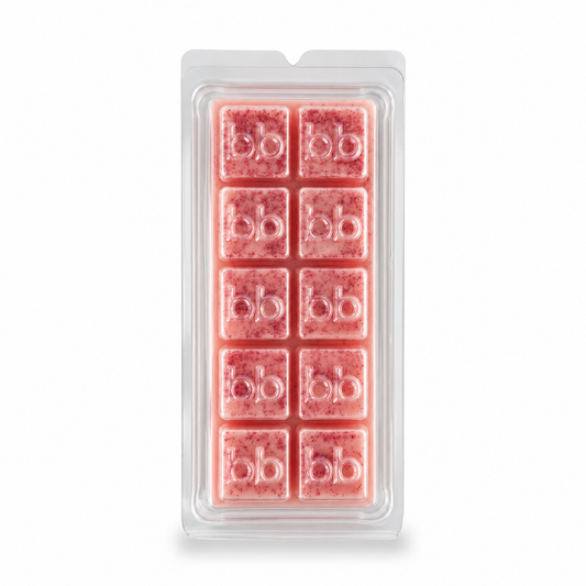 Berry Christmas raspberry and strawberry soy wax melts in a clear clamshell pack, speckled pink cubes embossed with the Bath Box logo