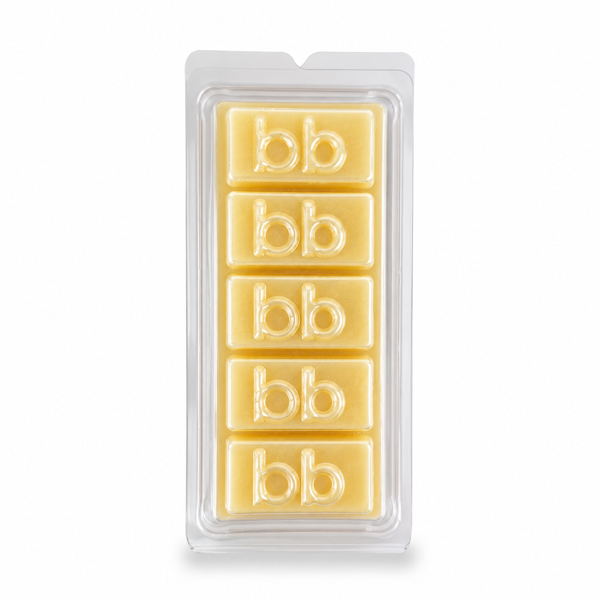 White Christmas sugar cookie soy wax melts in a clear clamshell pack, creamy ivory cubes embossed with the Bath Box logo