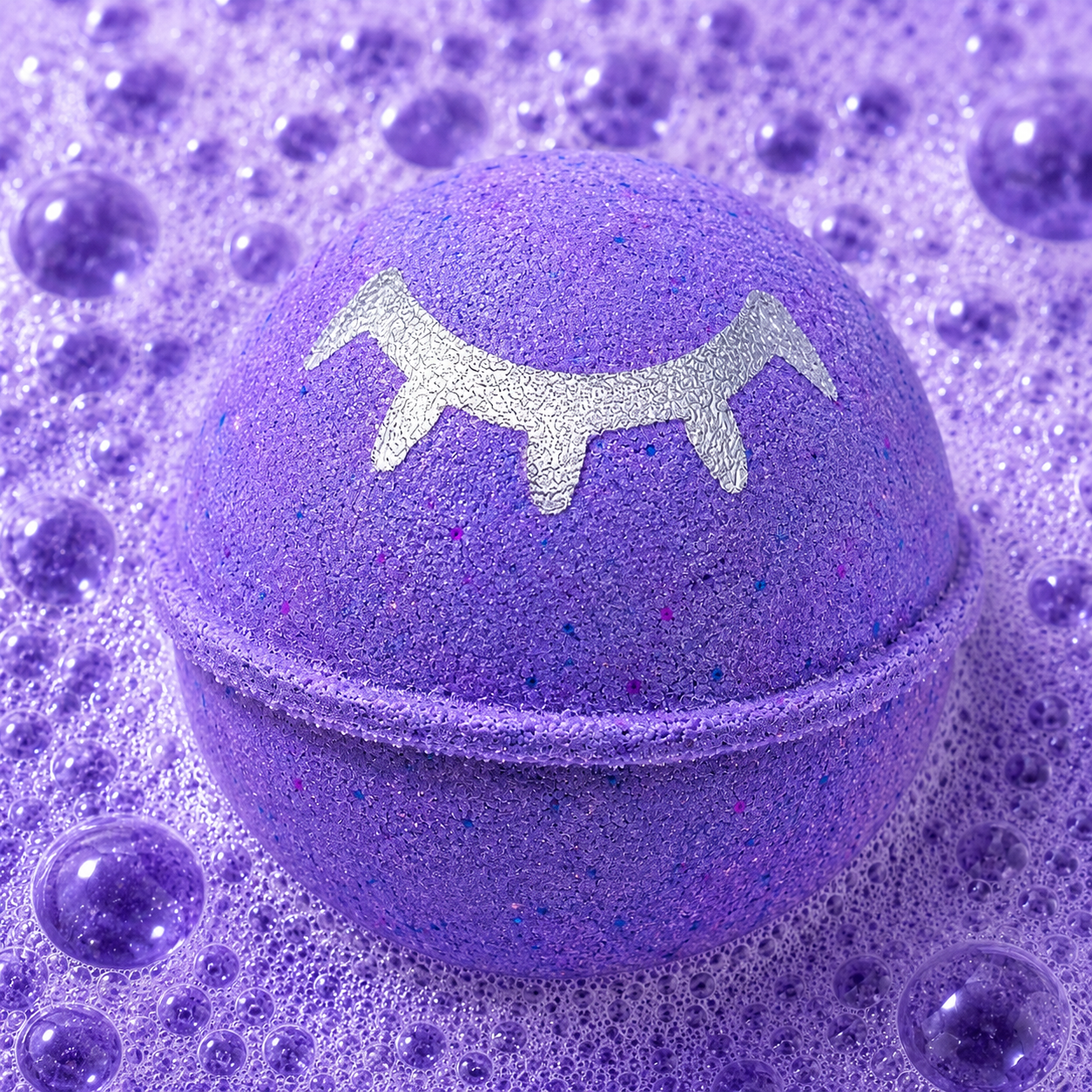 Sweet Dreams Cashmere Silk Bath Bomb fizzing in water by Bath Box